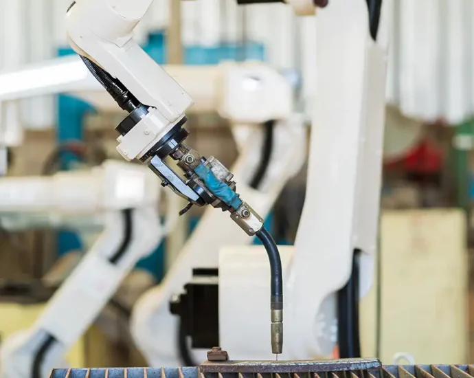 Automated manufacturing equipment showing how U.S. manufacturing jobs vs. output have changed